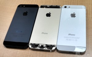 Apple's golden version of iPhone 5 beside black and white color model