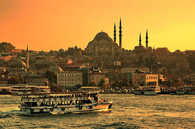 Turkish travel on Bosporus by boat to the golden sun dusk