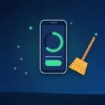 Phone cleaning app with a progress ring, a broom sweeping away junk and sparkles