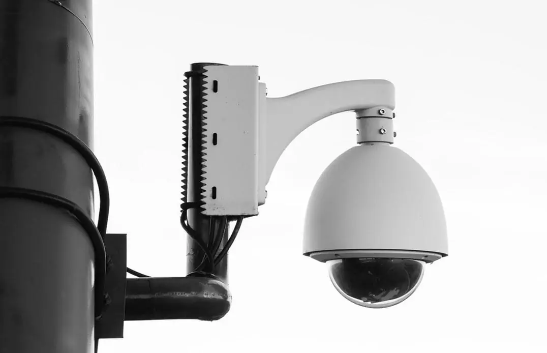 Dome security camera mounted on a pole