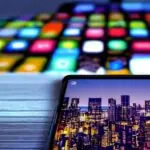 A close-up of the Samsung Galaxy S26 Ultra’s screen displaying an AI-powered interface with real-time language translation and smart scheduling features. Cinematic lighting highlights the vibrant colors and sharp details, set against a blurred cit…
