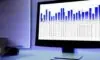 A dimly lit office monitor displays a complex Excel spreadsheet with highlighted financial data cells, illustrating a critical security vulnerability where legacy files interact unexpectedly with modern AI agents.