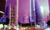A futuristic smart city street at night where autonomous vehicles, hovering drones, and holographic ads showcase the vibrant integration of 6G connectivity and AI in daily life.