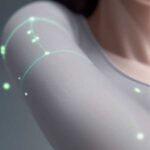 Close-up of seamless smart clothing with subtle, glowing circuit patterns, illustrating integrated, passive health monitoring technology.