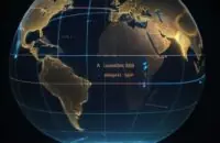 Une visualisation numérique d'un globe terrestre connecté par des lignes de lumière, illustrant la conversion d'un nom de domaine en adresse numérique dans un réseau global.